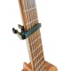 Photo of the Capo Leon model SC-03B placed on the neck of a guitar