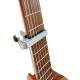 Photo of the Capo Leon model SC-03C placed on the neck of a guitar