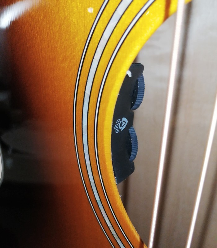 Preamp detail of the electroacoustic guitar Guild model F 250CE Jumbo Cutaway with Antique Burst
