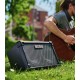 Amplifier Boss model Cube Street II for guitar on a park resting on  grass