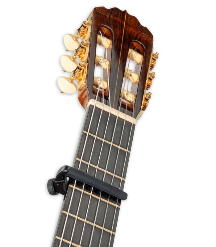 Capo D'Addario model PW CP 19 NS Capo Pro on the neck of a classical guitar