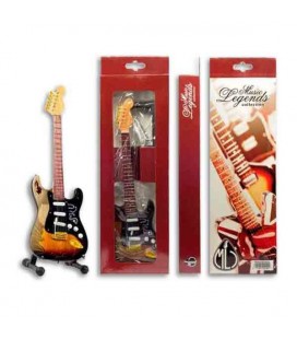 Imagen de una guitarra eléctrica en miniatura en el soporte y el embalaje.