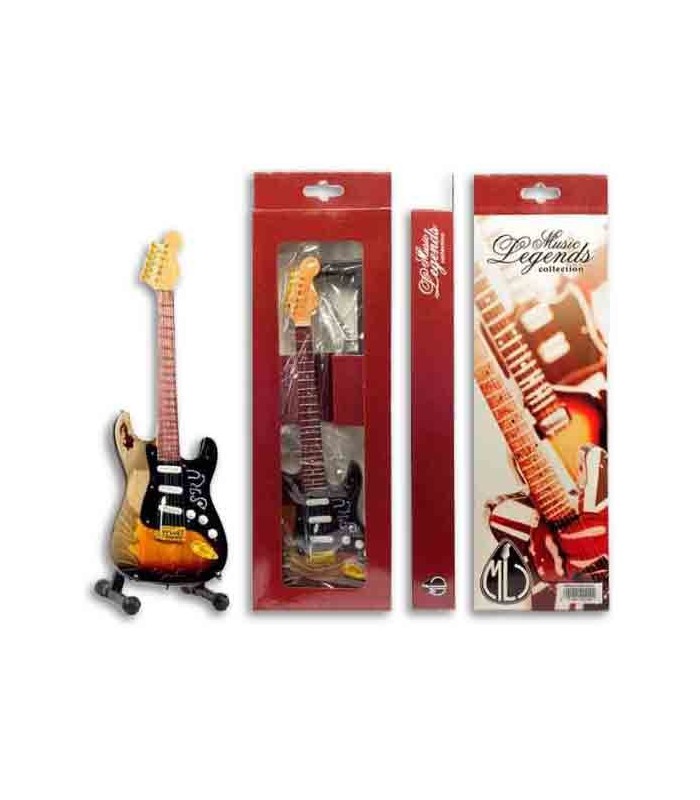 Imagen de una guitarra eléctrica en miniatura en el soporte y el embalaje.