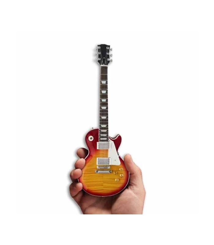 Picture of a miniature electric guitar on the stand 