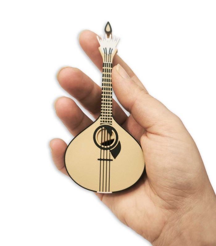 Portuguese guitar-shaped pick holder held in a hand