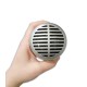 Frontal  photo of microphone Shure SH 520DX for harmonica in the hand